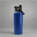 Blue water bottle with black cap on a gray background